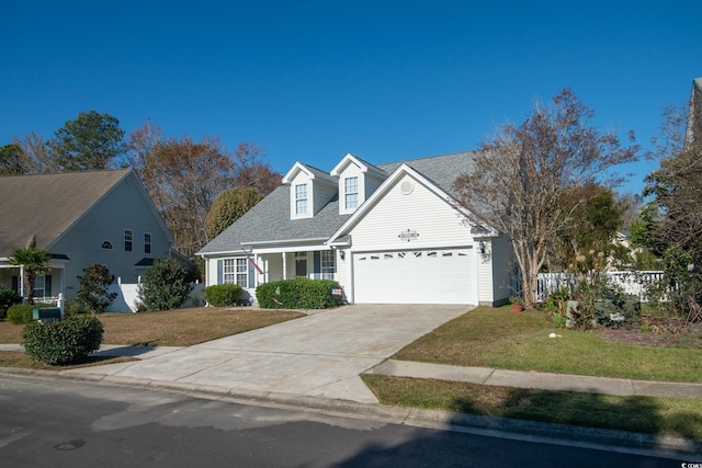 view of front of home featuring a garage and a front lawn