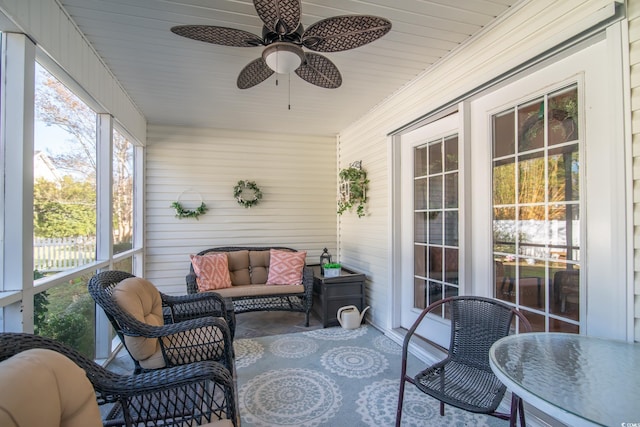 sunroom / solarium with ceiling fan