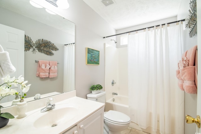 full bathroom featuring vanity, a textured ceiling, shower / bathtub combination with curtain, tile patterned flooring, and toilet