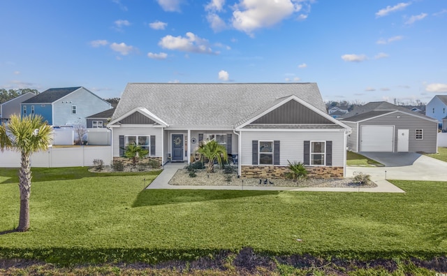 view of front of home featuring a front yard and a garage