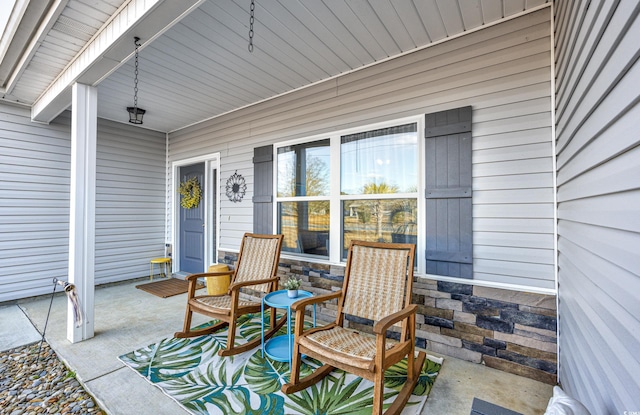 view of patio featuring a porch