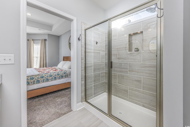 bathroom with a shower with shower door