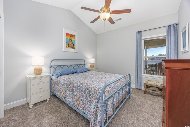 carpeted bedroom featuring ceiling fan and lofted ceiling