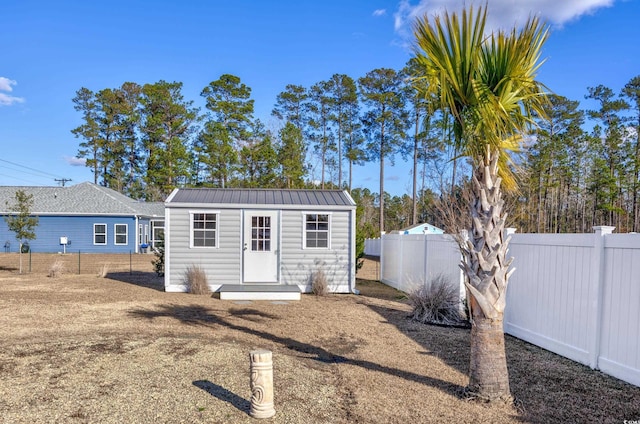 back of property with an outbuilding