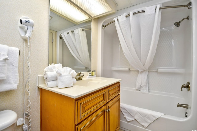 bathroom with shower / bath combo and vanity