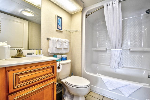 full bathroom featuring tile patterned flooring, vanity, toilet, and shower / bath combo with shower curtain