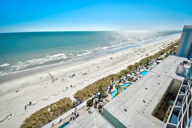 birds eye view of property featuring a view of the beach and a water view