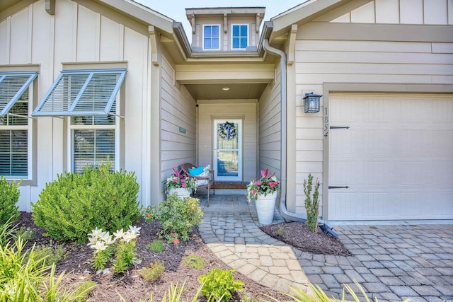 view of exterior entry featuring a garage