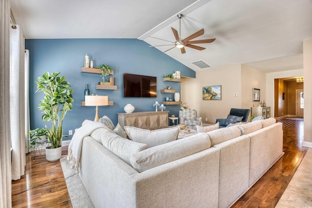 living room with ceiling fan, dark hardwood / wood-style floors, and lofted ceiling