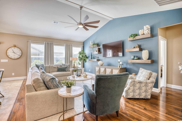 living room with vaulted ceiling with beams, ceiling fan, and wood-type flooring