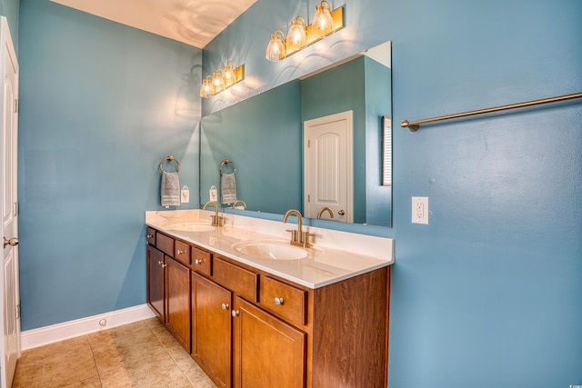 bathroom featuring tile patterned flooring and vanity