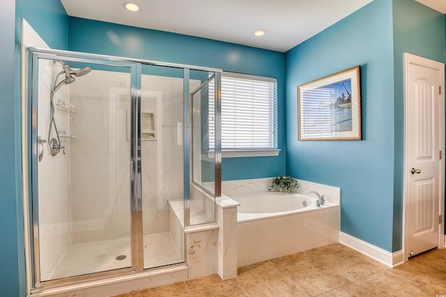 bathroom with tile patterned flooring and independent shower and bath