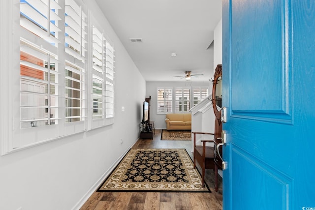 entrance foyer featuring ceiling fan and hardwood / wood-style flooring