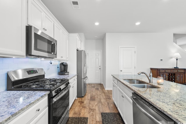 kitchen with white cabinetry, sink, and appliances with stainless steel finishes