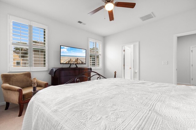 bedroom with ceiling fan and carpet floors