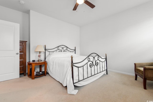 bedroom featuring ceiling fan and light colored carpet