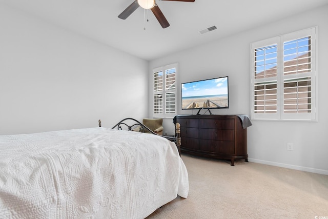 carpeted bedroom with ceiling fan and lofted ceiling