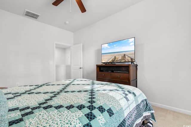 bedroom featuring light carpet and ceiling fan