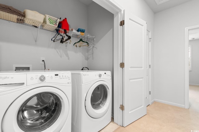 laundry area with light colored carpet and washing machine and clothes dryer