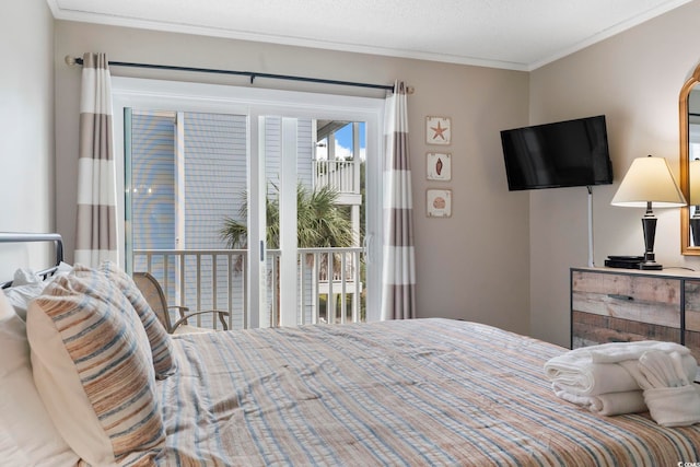 bedroom with access to outside and ornamental molding