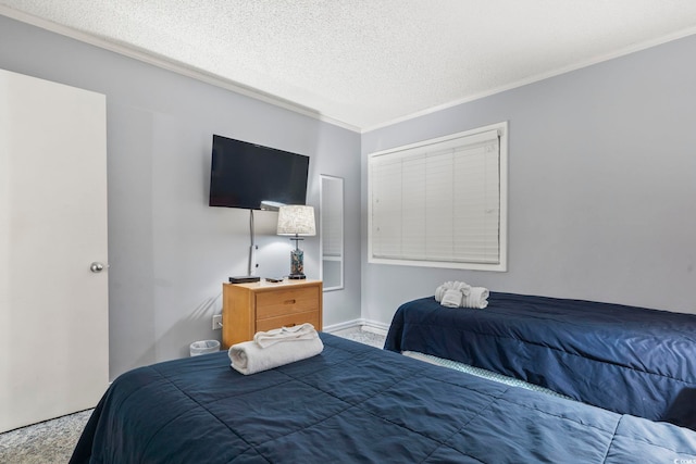 bedroom featuring carpet flooring, a textured ceiling, and ornamental molding