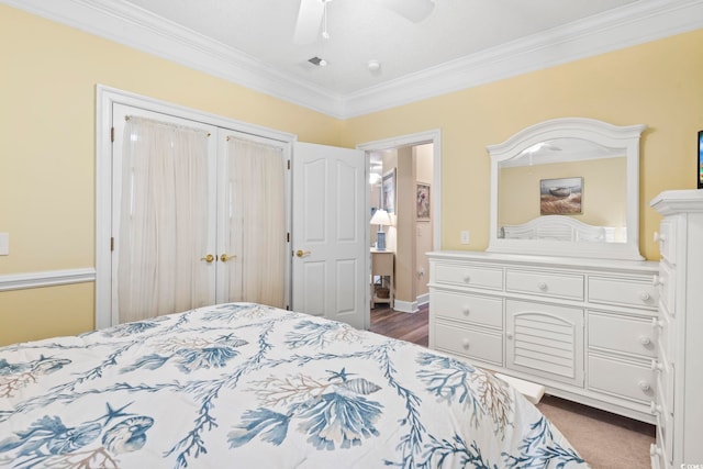 bedroom with ceiling fan and ornamental molding