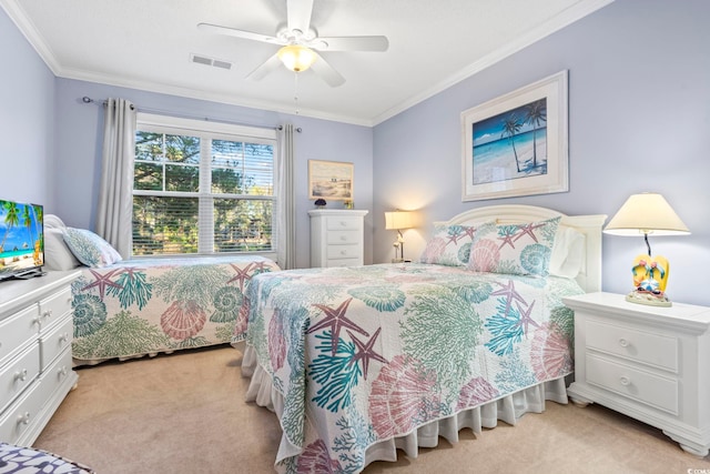 bedroom featuring ceiling fan, crown molding, and light colored carpet