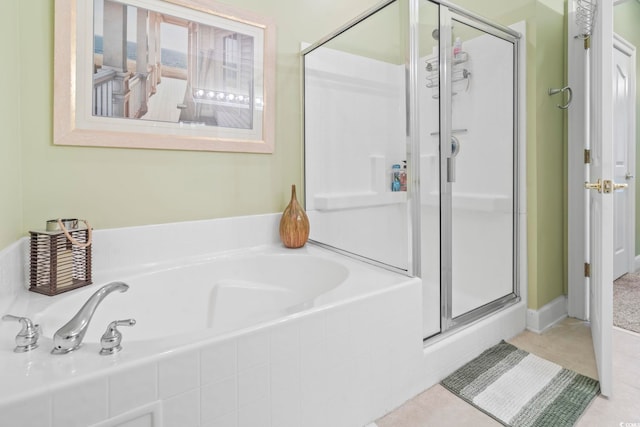 bathroom with tile patterned floors and plus walk in shower