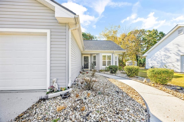 doorway to property featuring a garage