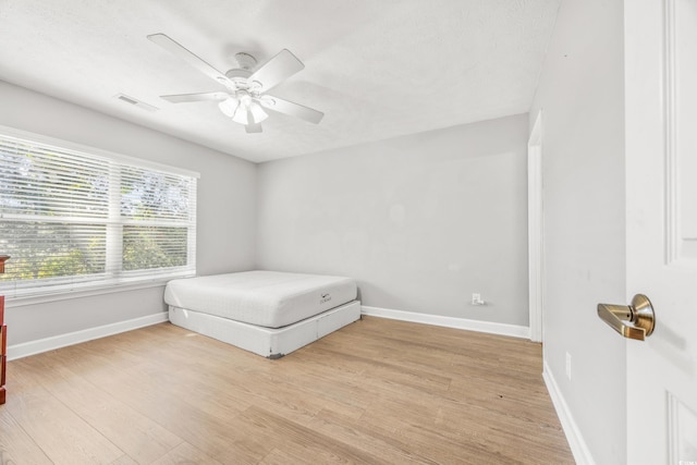 bedroom featuring ceiling fan and light hardwood / wood-style flooring