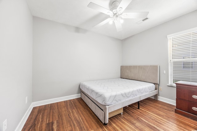 bedroom featuring hardwood / wood-style flooring and ceiling fan