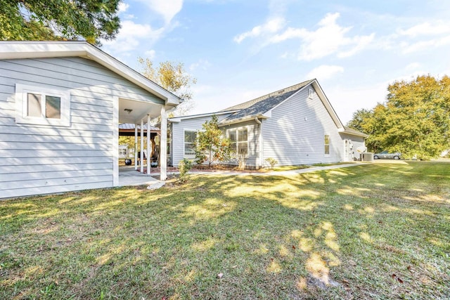 exterior space featuring a lawn and a patio area