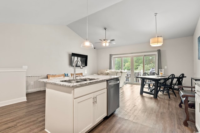 kitchen featuring wood finished floors, a sink, white cabinetry, hanging light fixtures, and stainless steel dishwasher