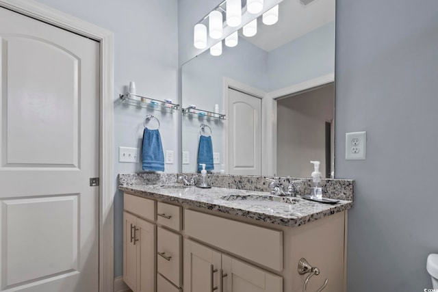 bathroom with double vanity and a sink