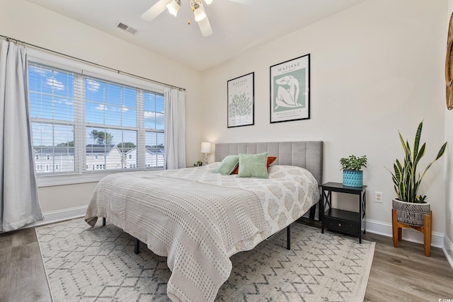 bedroom featuring hardwood / wood-style floors and ceiling fan