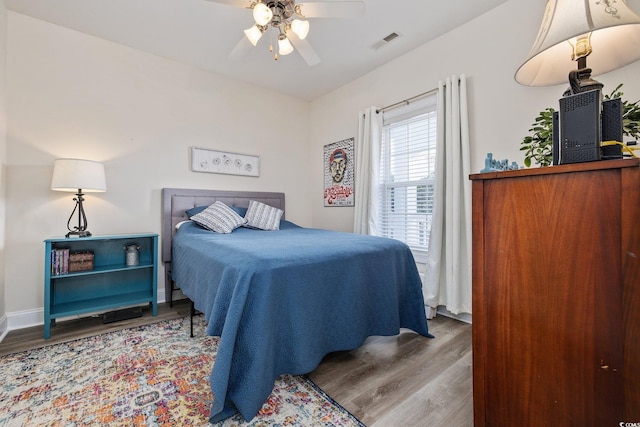 bedroom featuring hardwood / wood-style flooring and ceiling fan