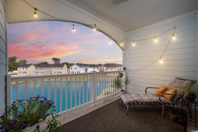 view of balcony at dusk