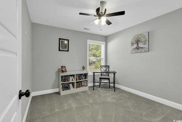 carpeted office with ceiling fan