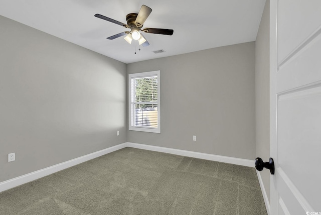 spare room with carpet and ceiling fan