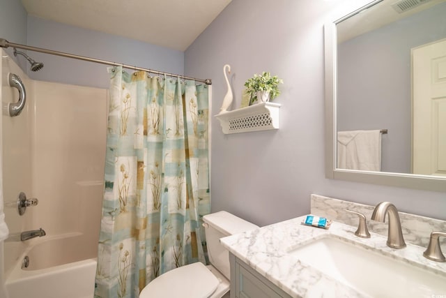 full bathroom featuring shower / tub combo, vanity, and toilet