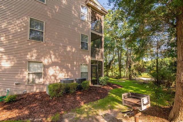 view of home's exterior with a lawn