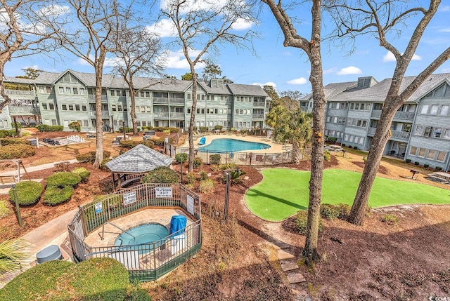 surrounding community featuring a hot tub