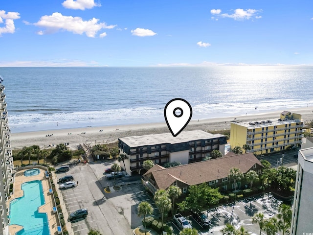 drone / aerial view with a view of the beach and a water view