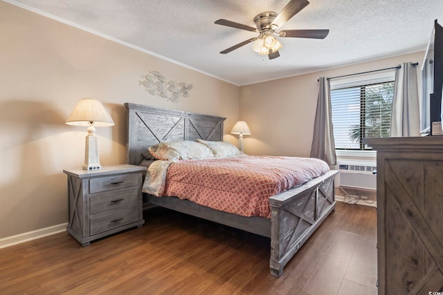 bedroom featuring ceiling fan, dark hardwood / wood-style flooring, a textured ceiling, and a wall unit AC