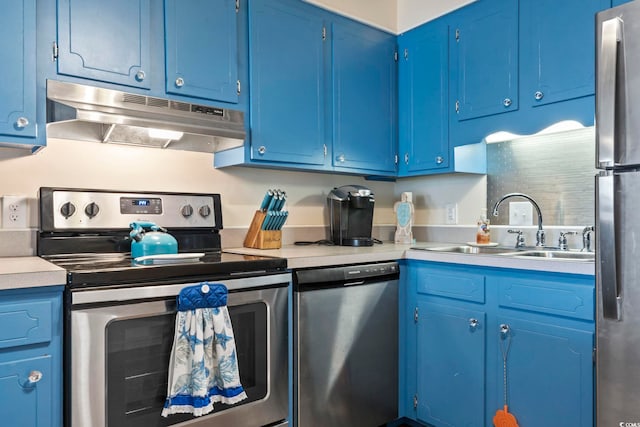 kitchen with stainless steel appliances, blue cabinets, and sink