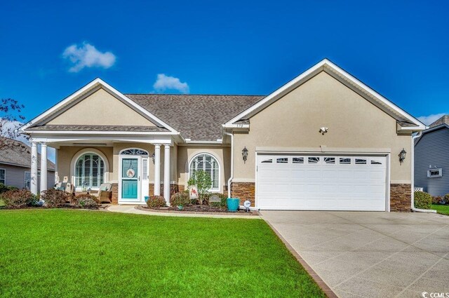 view of front of house with a front lawn and a garage