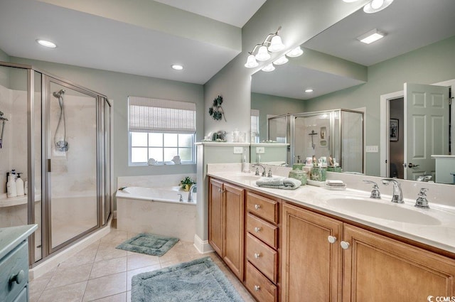 bathroom with tile patterned flooring, vanity, and independent shower and bath