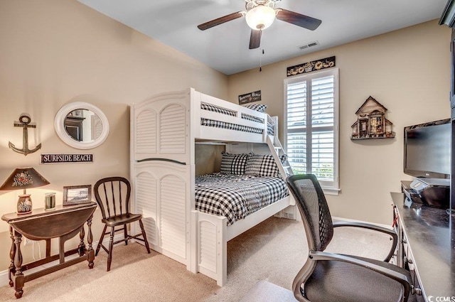 carpeted bedroom with multiple windows and ceiling fan