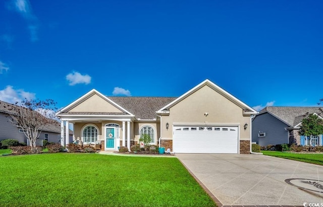 view of front facade with a garage and a front lawn