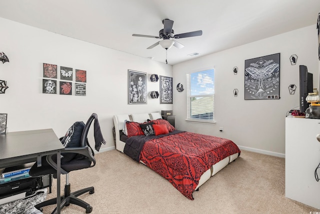 bedroom featuring ceiling fan and light colored carpet